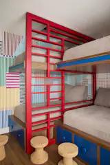 Because the home is used by extended family—often with multiple families staying at the same time—a bunk room was a particularly efficient use of space, especially when combined with underbed storage.