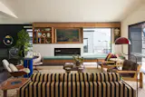 For the furniture and furnishings, Olson notes that she "leaned on vintage pieces referencing midcentury and postmodern styles updated with contemporary flair.” Spaces like the living room combines time periods, colors, and textures.