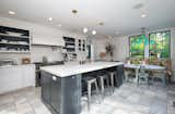 The home's kitchen channels farmhouse-chic with a distinctly cosmopolitan sensibility.