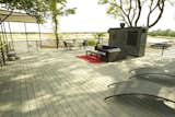 1000 sq ft roof deck featuring canvas awning/movie screen and dumbwaiter adjacent to fireplace