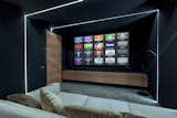 Acoustically transparent screen and hidden speaker units in the home cinema