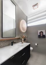 Bath Room, One Piece Toilet, Engineered Quartz Counter, Ceiling Lighting, Stone Tile Wall, Porcelain Tile Floor, and Wall Lighting  Photo 14 of 22 in Sacramento Streng Bros Home by Benning Design Construction