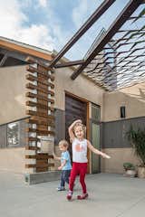 The grandchildren love to play here, taking full advantage of the easy flow indoors to out.  Photo 4 of 7 in The Modern Mission by Modern Architecture Services