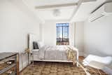 Roomy bedroom with soaring city views