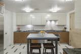 A formal and functional chefs kitchen with enough room for additional seating