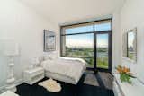 Simplicity at its finest in this bedroom. Your eye is drawn outside.