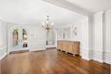 Wooden floors and large doors gift light and movement to the space