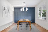 The dining area is darling: subdued blue hues and simple furnishings make the space cozy yet modern.