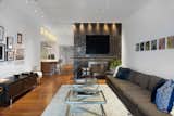 Living Room The home has been meticulously renovated and features an open-concept living and dining area, and stunning new oak hardwood floors.  Photo 1 of 7 in Reimagined Tribeca Condo for $3.15M by Compass 