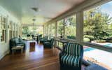 Take a breather on the covered porch overlooking the outdoor pool