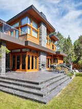 Luxurious top quality stone, wood and glass come together to provide an spacious and elegant back yard presence