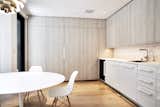Breakfast Room - Saarinen Tulip Table, Eames side chairs, Miele appliances, Louis Poulsen PH Stainless Steel Artichoke light