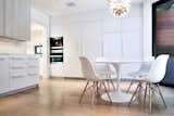 Breakfast Room - Saarinen Tulip Table, Eames side chairs, Miele appliances, Louis Poulsen PH Stainless Steel Artichoke light