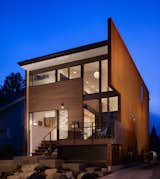 Corten steel walls bracket two story living spaces that open to the front and rear yards.