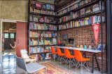The study with floor to ceiling book shelves double up as internet browsing area and home tuition