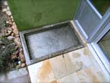 This Water Basin at the Front Door Step may be used for Washing or for Animals