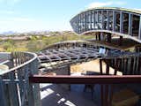 By using long span steel beams and open web bar joists, we were able to create dramatic wide open spaces that have multiple stepped levels to allow indirect light.