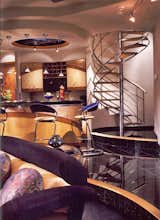 Stainless Steel Spiral Stair, stone treads & leather bottoms.