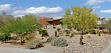 Earth-Contact Arizona Desert Home/Office acts as a buffer to the street corner on what was originally a flat, gently sloped lot.