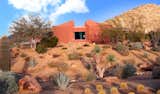 Earth-Contact Arizona Desert Home/Office acts as a buffer to the street corner on what was originally a flat, gently sloped lot.