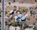 This home office and 6 car garage is completely submerged below the desert landscape, two double garage doors at each end provide vehicle access, while 2 sets of stairs service the upper office. 