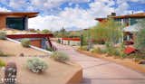 This home office and 6 car garage is completely submerged below the desert landscape, two double garage doors at each end provide vehicle access, while 2 sets of stairs service the upper office. 