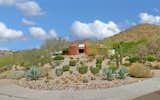 Earth-Contact Arizona Desert Home/Office acts as a buffer to the street corner on what was originally a flat, gently sloped lot.