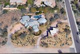Earth-Contact Arizona Desert Home/Office acts as a buffer to the street corner on what was originally a flat, gently sloped lot.