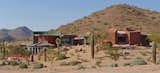 Earth-Contact Arizona Desert Home/Office acts as a buffer to the street corner on what was originally a flat, gently sloped lot.