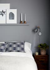 The calming grey colour scheme continues in the guest bedroom. Cushions by Eleanor Pritchard.