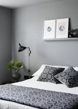 The master bedroom, with calming grey paintwork and welsh blanket and cushions by Melin Tregwynt.