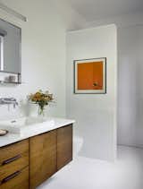 Curbless and doorless shower for easy accessibility. Linear drain. Floating vanity. 