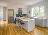 Kitchen, Refrigerator, Range, Medium Hardwood Floor, Glass Tile Backsplashe, Ceiling Lighting, and Undermount Sink  Photos from Wellfleet Modern