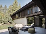 Exterior, Stone Siding Material, Metal Roof Material, House Building Type, Mid-Century Building Type, Wood Siding Material, Flat RoofLine, and Glass Siding Material  Photo 9 of 18 in LAKE TAHOE | LAKEFRONT HOUSE by RO  |  ROCKETT DESIGN