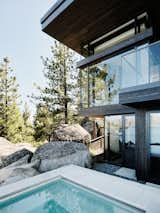 Exterior, Metal Roof Material, House Building Type, Stone Siding Material, Glass Siding Material, Flat RoofLine, Mid-Century Building Type, and Wood Siding Material  Photo 16 of 18 in LAKE TAHOE | LAKEFRONT HOUSE by RO  |  ROCKETT DESIGN