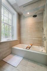 Bath Room, Recessed Lighting, Stone Tile Wall, One Piece Toilet, and Stone Counter  Photos from Charming West Village Condo