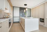 Kitchen, Wood Cabinet, Marble Counter, Ceramic Tile Backsplashe, and Medium Hardwood Floor  Photo 14 of 18 in Summer Above Soho by Interior Marketing Group