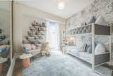 Bedroom, Medium Hardwood Floor, Shelves, Pendant Lighting, Bunks, Bookcase, and Chair  Photo 10 of 18 in Summer Above Soho by Interior Marketing Group