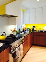 Yellow, white, walnut kitchen