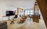 Dining area with custom built in shelving and cabinets, view from apartment entry