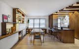 Dining area and kitchen with custom walnut cabinetry and millwork