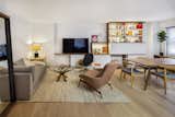 Living and dining area with built in shelving and cabinetry