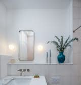 Bath Room, Wall Lighting, Cement Tile Floor, Ceiling Lighting, Marble Counter, Recessed Lighting, Undermount Sink, Accent Lighting, and One Piece Toilet The only white wall in the home  Photo 17 of 25 in Nomadic Nest by Andrew Mikhael Architect
