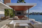 A waterfront conversation pit brings a touch of midcentury glamour to this two-story, seven-bedroom oasis designed by Choeff Levy Fischmann in Miami Beach, Florida.&nbsp;
