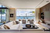 This formal living room on the first floor allows for views of the glistening bay.