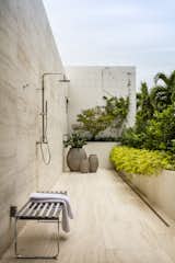A balcony with a private outdoor shower sits just outside the master bedroom’s ensuite bathroom.