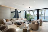 The living room with floor-to-ceiling sliding glass doors that open up to the rear deck, blending the indoors with the outdoors.