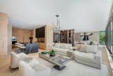 Large open living area with kitchen, two lounge areas and dining room.  Interiors by CB Design.