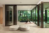 The gym, which can also be utilized as office space, overlooks the flowing water feature.