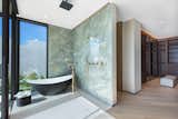 Both master marble bathrooms have a stand-alone bathtub, and shower.